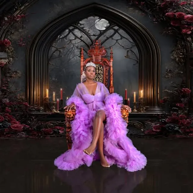 Creative studio portrait with crown and dramatic set design