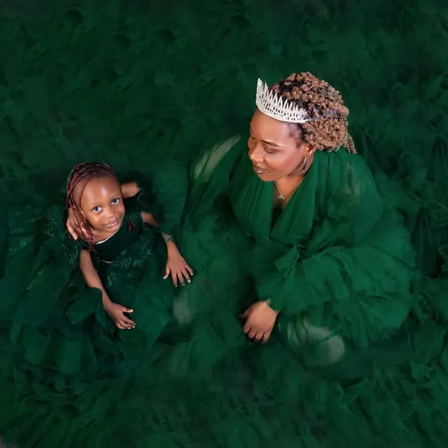Mother and daughter portrait in matching emerald gowns