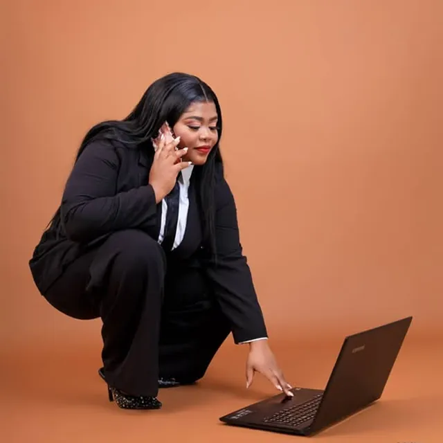 Personal branding portrait, business suit with a laptop