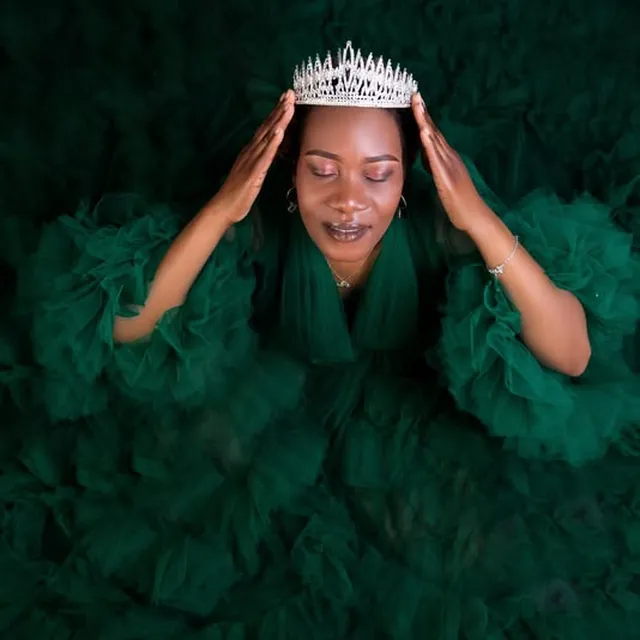 Creative studio portrait, emerald tulle gown