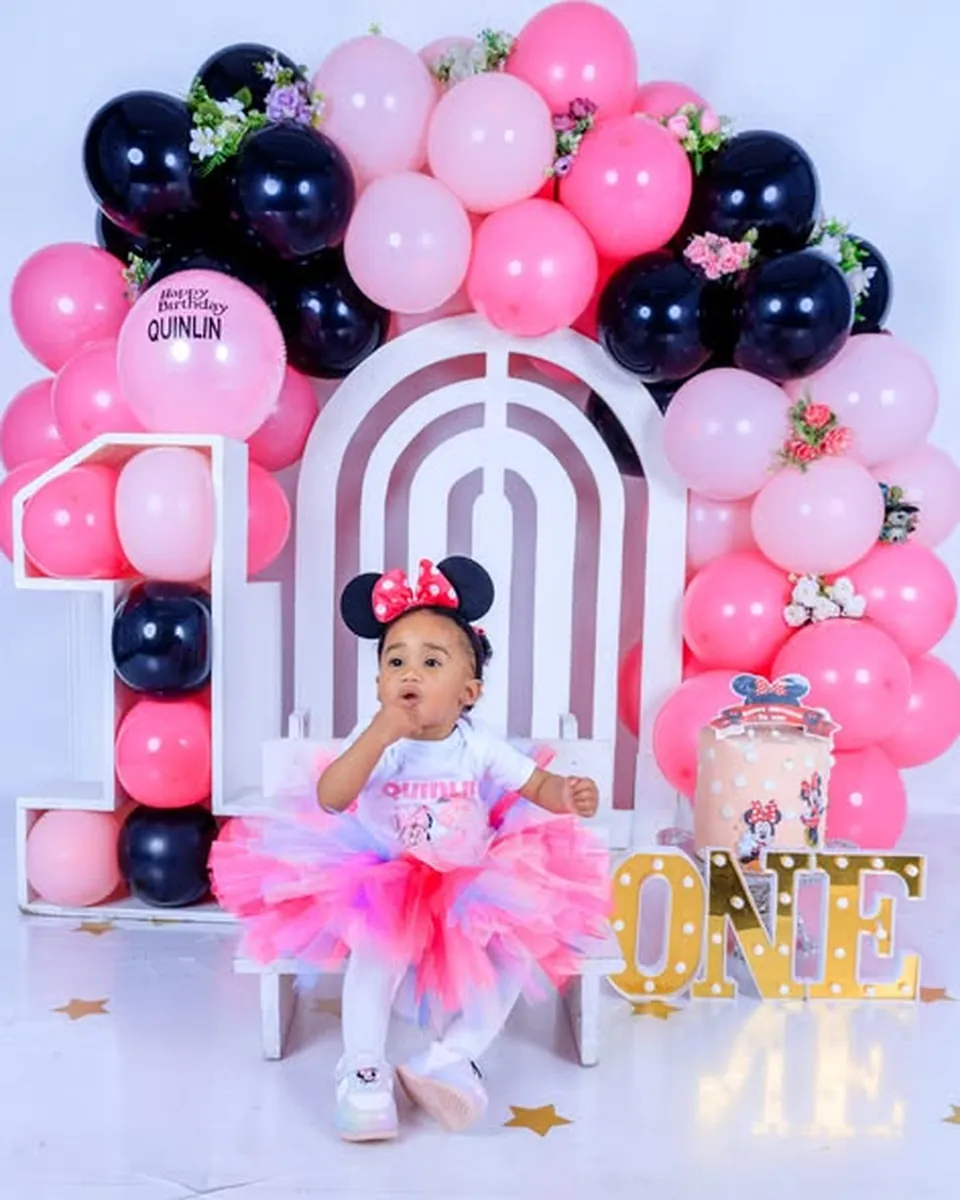 First birthday cake smash session with pink and navy balloon arch